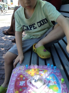 A couple of rousing games of Hello Kitty Trouble next to Town Hall. 
